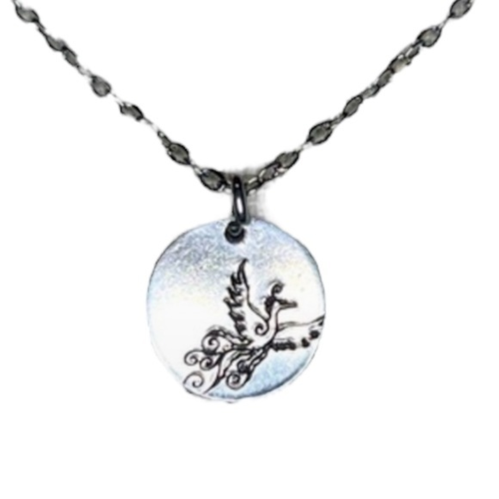 Handmade stamped Phoenix 1/2 inch silver pendant
20in stainless steel necklace‎